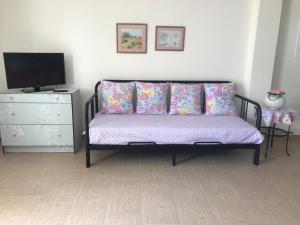 TV a/nebo společenská místnost v ubytování Armonia Apartment