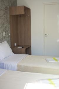 Postel nebo postele na pokoji v ubytování Anhembi Hostel