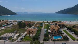 an aerial view of a resort and the water at Hotel Odeon in Vasiliki