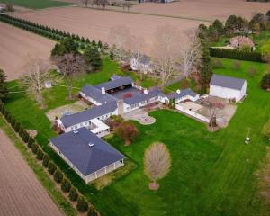 an aerial view of a large house with a yard at Millsite Lodge in Sandusky