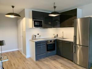 Kuchyň nebo kuchyňský kout v ubytování Inselliebe Deluxe Apartement/ Studio