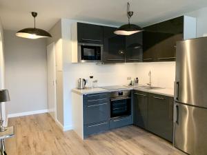Kuchyň nebo kuchyňský kout v ubytování Inselliebe Deluxe Apartement/ Studio