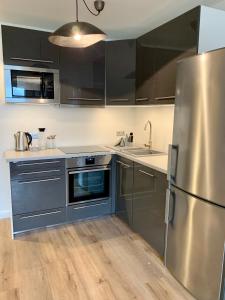 A kitchen or kitchenette at Inselliebe Deluxe Apartement/ Studio