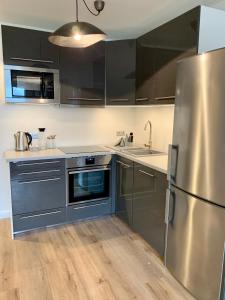 Kuchyň nebo kuchyňský kout v ubytování Inselliebe Deluxe Apartement/ Studio + 18 fotografií