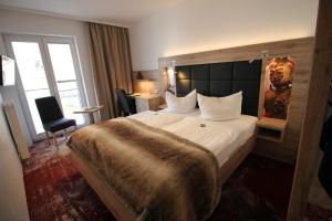 Postel nebo postele na pokoji v ubytování Wellness & Ayurveda Hotel Am Eichenberg