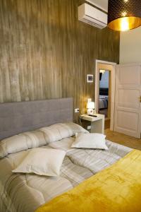 Postel nebo postele na pokoji v ubytování Ad Astra Rooms