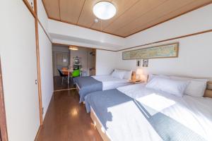 SUNDAY peace room 中島 #24客房内的一张或多张床位