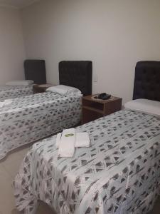 Ein Bett oder Betten in einem Zimmer der Unterkunft Hotel Athenas e Convenções