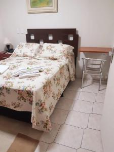 Ein Bett oder Betten in einem Zimmer der Unterkunft Hotel Athenas e Convenções