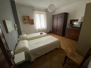 מיטה או מיטות בחדר ב-Casa Degli Eroi