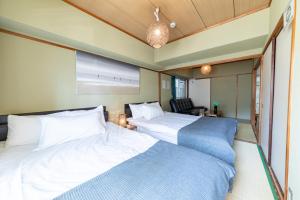 SUNDAY peace room 中島 #24客房内的一张或多张床位