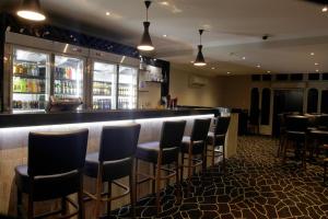 Lounge atau bar di Cattlemans Country Motor Inn & Serviced Apartments