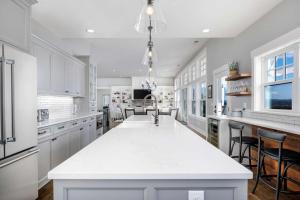 a kitchen with white cabinets and a white counter top at The Gables at Quandary Vineyards in Yamhill