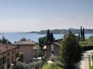 a view of a town with a lake in the background at VALLE FIORITA 42 - Lake view apartment in Gardone Riviera