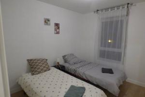 Postel nebo postele na pokoji v ubytování T3 Spacieux, Renové en 2020 -Pkg-métro