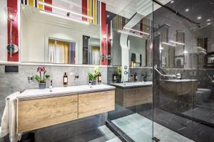 a bathroom with two sinks and a shower at Arte' Boutique Hotel in Florence +53 photos