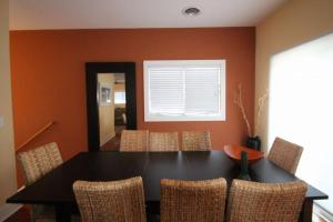 a dining room with a black table and chairs at 96 Mays Way, SOUTH Bethany Beach in Bethany Beach +35 photos