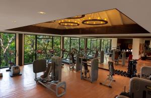 a gym with a lot of treadmills and ellipticals at Banyan Tree Cabo Marques in Acapulco