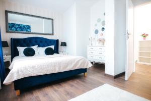 Ένα ή περισσότερα κρεβάτια σε δωμάτιο στο Penthouse Evianne Faleza
