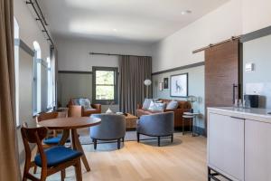 a kitchen and living room with a table and chairs at Lora in Stillwater