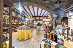 a store filled with lots of bottles of wine at Apartamentos Casa Rivera in Aínsa