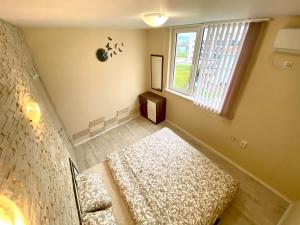 A bed or beds in a room at Sea View NewApartment-Bulgaria-Chernomorets