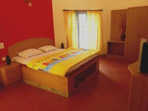 Postel nebo postele na pokoji v ubytování The Casiita Coorg