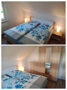 - une chambre avec un lit orné de fleurs bleues dans l'établissement Ferienwohnung Rothen-Adler, à Breitenbrunn/Erzgeb.