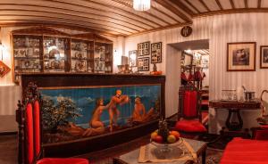 a living room with a large fish tank at Ilion Hotel in Nafplio