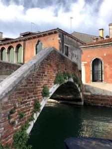 a bridge over a river in a city at Ca Bea in Venice