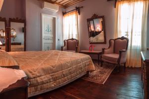 Кровать или кровати в номере Ilion Hotel