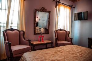Кровать или кровати в номере Ilion Hotel