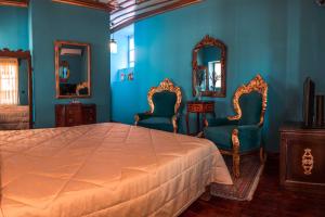 Кровать или кровати в номере Ilion Hotel