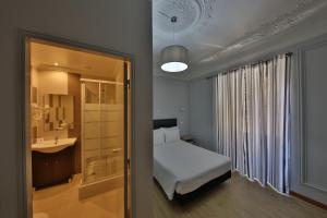 Postel nebo postele na pokoji v ubytování O Elétrico Guesthouse + 81 fotografií