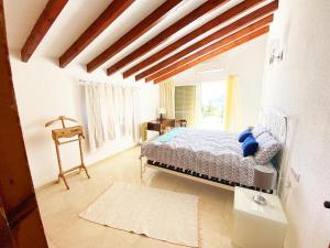 A bed or beds in a room at Casa Puput