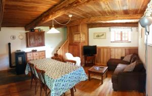 a living room with a table and a couch at Chalet Courmayeur in Courmayeur