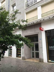 a facade of a building with glass doors at Studio Picnic in Chambéry +2 photos