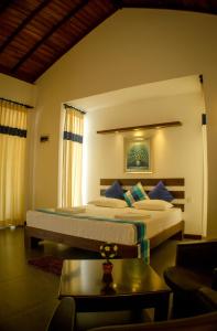 Ένα ή περισσότερα κρεβάτια σε δωμάτιο στο Hotel Alakamanda