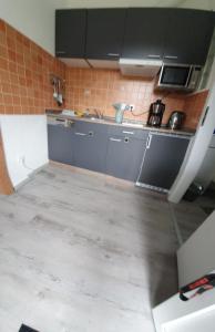 a kitchen with a sink and a counter top at FeWo Tina in Lübeck