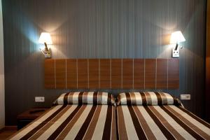 Cama o camas de una habitación en Hostal Bcn 46