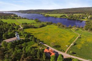an aerial view of a field and a river at Asa Vandrarhem in Lammhult