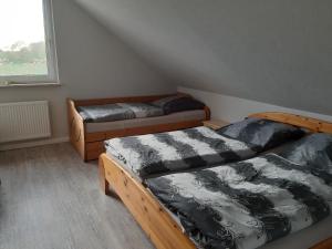 Voodi või voodid majutusasutuse Ferienwohnung Schwalbennest toas