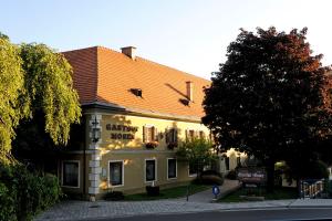 a building with a sign on the front of it at Gasthof Hotel Moser in Guttaring