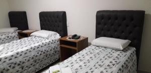 Ein Bett oder Betten in einem Zimmer der Unterkunft Hotel Athenas e Convenções