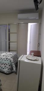 Ein Bett oder Betten in einem Zimmer der Unterkunft Hotel Athenas e Convenções