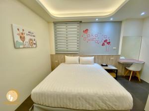 Rúm í herbergi á Ta Lang Guan Hai Mei Su B&B