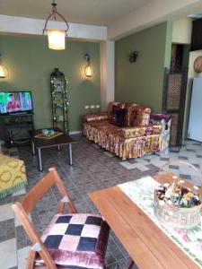 a living room with a couch and a table at DOWN TOWN LUXURY Apartment in Sarandë