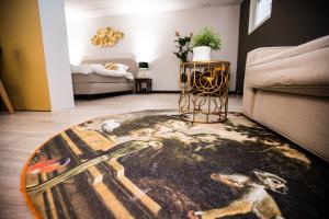 a living room with a rug on the floor at appartement - sauna - natuur - Utrecht in Soest