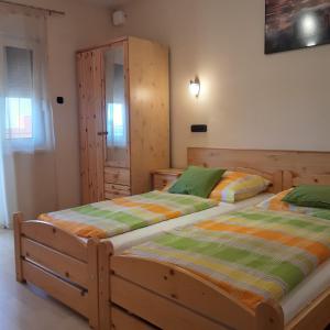 Postel nebo postele na pokoji v ubytování Pannon Panzió Restaurant