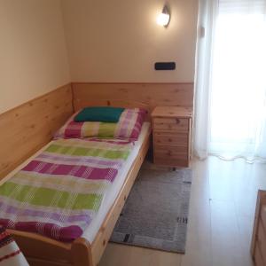 Postel nebo postele na pokoji v ubytování Pannon Panzió Restaurant
